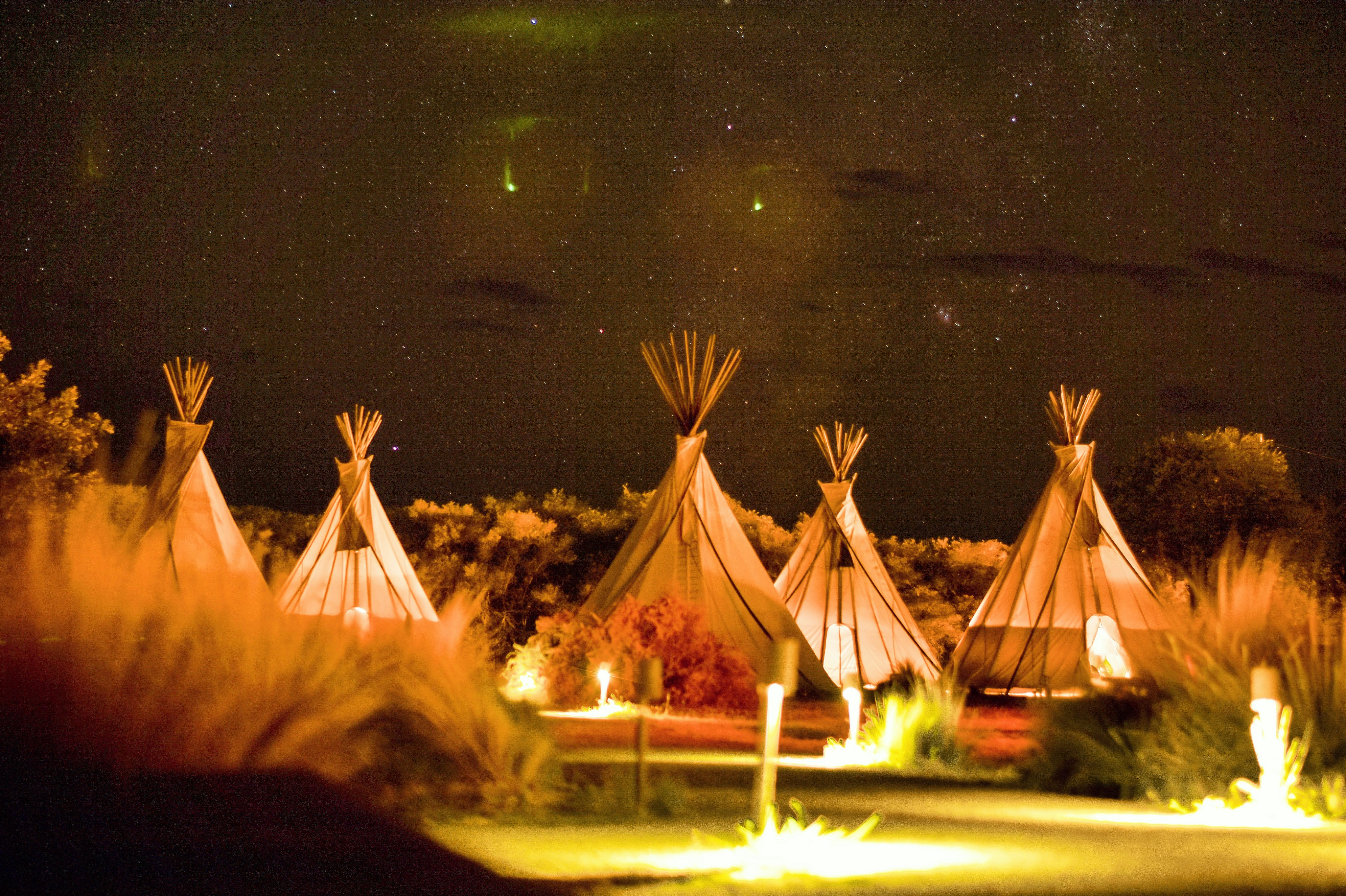 Glamping tent with outdoor seating area